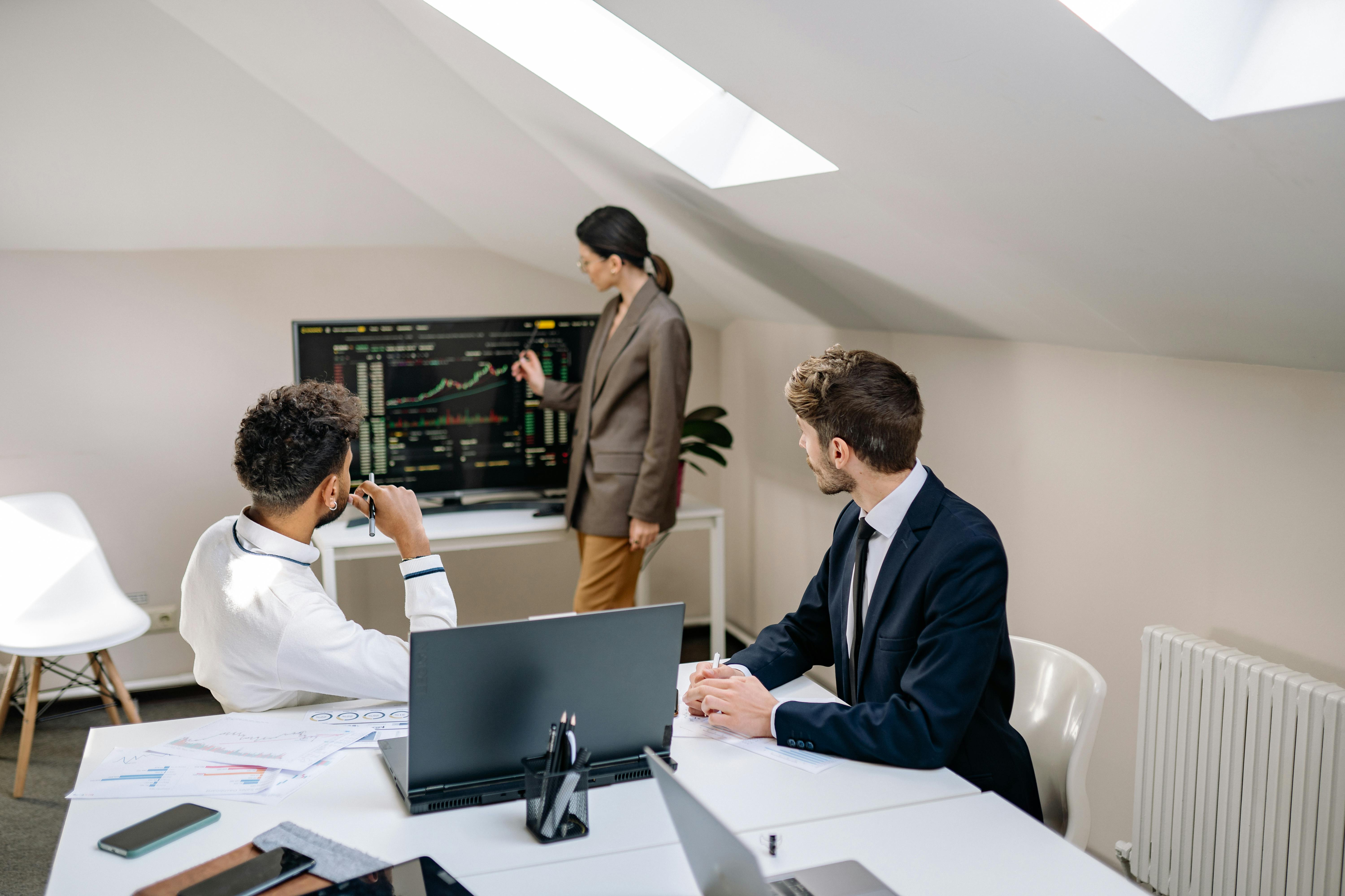 Business professionals analyzing ROI data and financial metrics in a secure, modern office environment